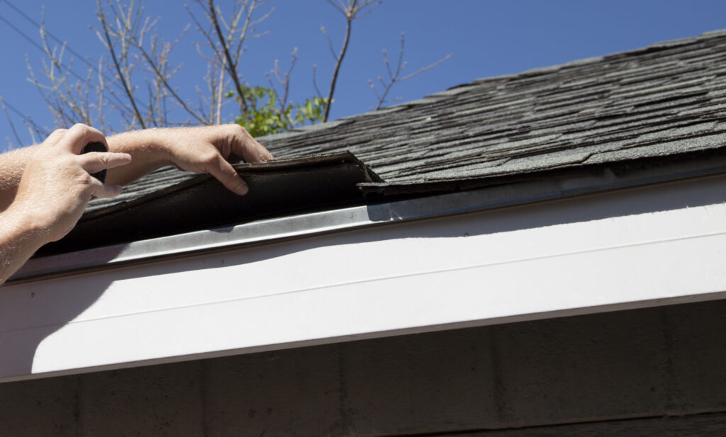  Roof inspection in McFarland, WI checking shingles for repairs.

