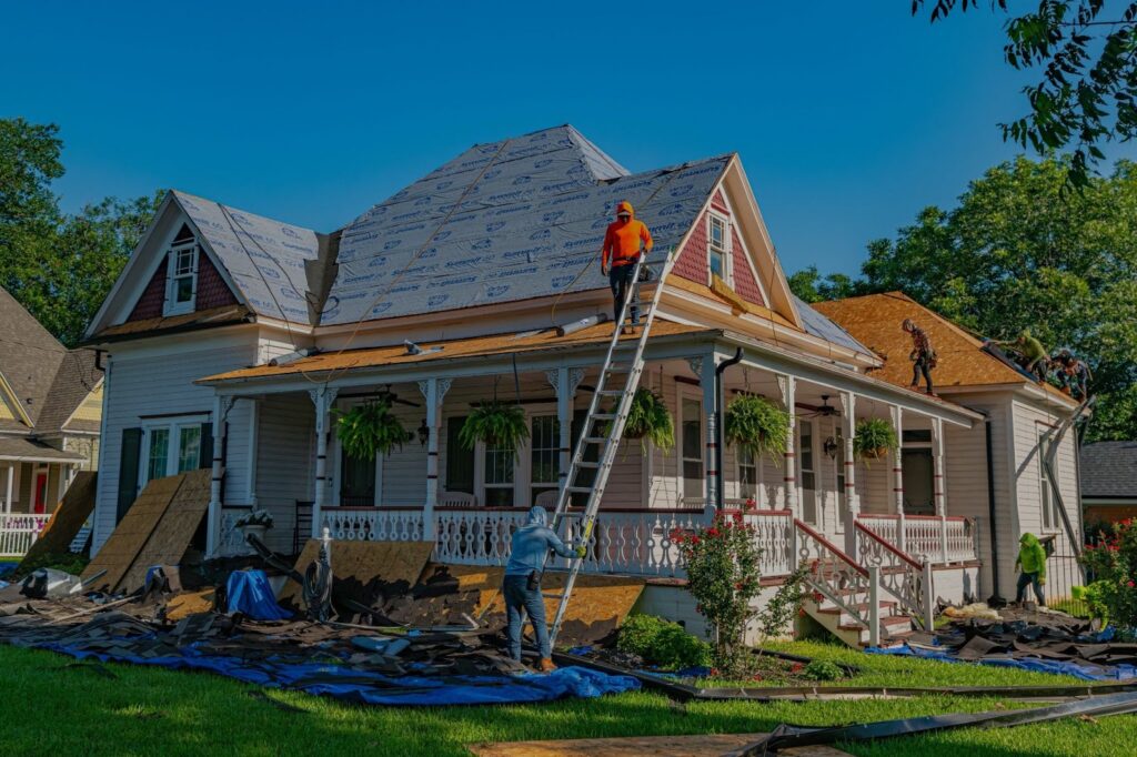 Professional roofing crew completing a full roof replacement on a residential home in Wisconsin