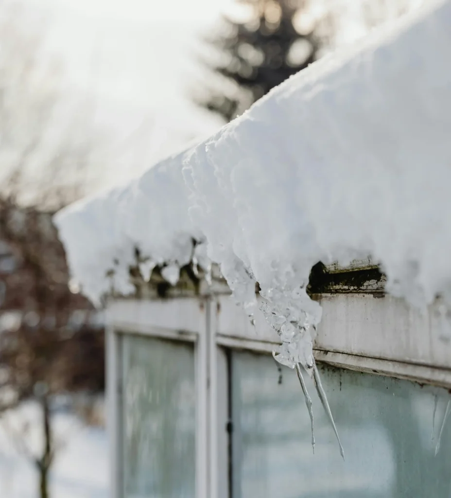 ice dam buildup causing winter roof damage and hidden roof leaks in Wisconsin