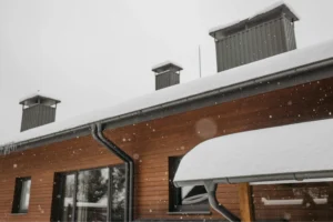 snow buildup causing winter roof damage in Wisconsin home